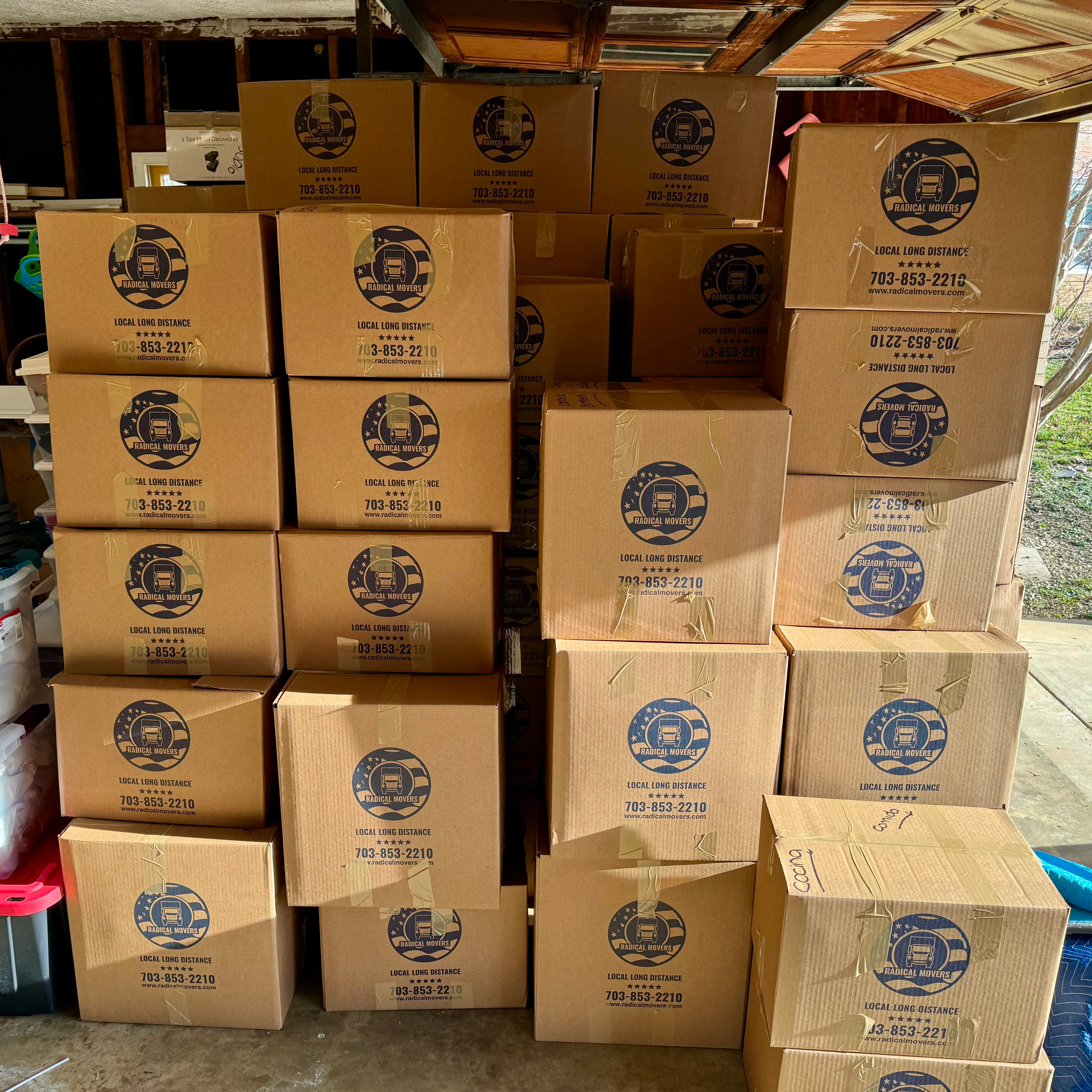 Professional packers carefully wrapping fragile items for move