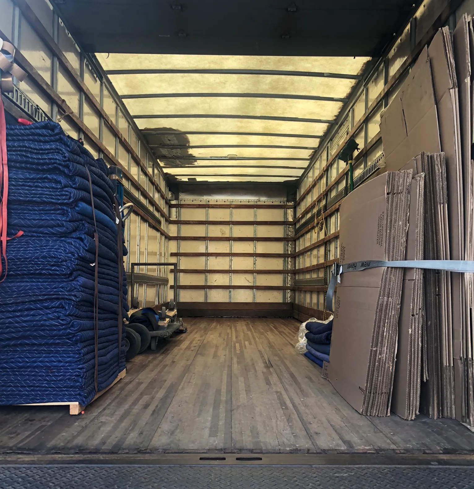 Professional movers demonstrating proper packing techniques