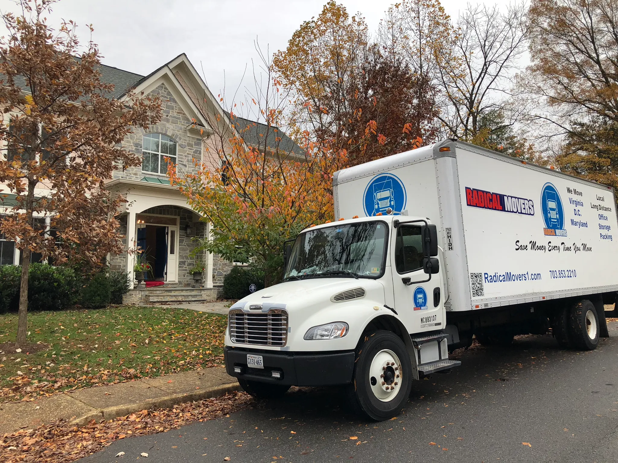 Radical Movers team carrying furniture for local move