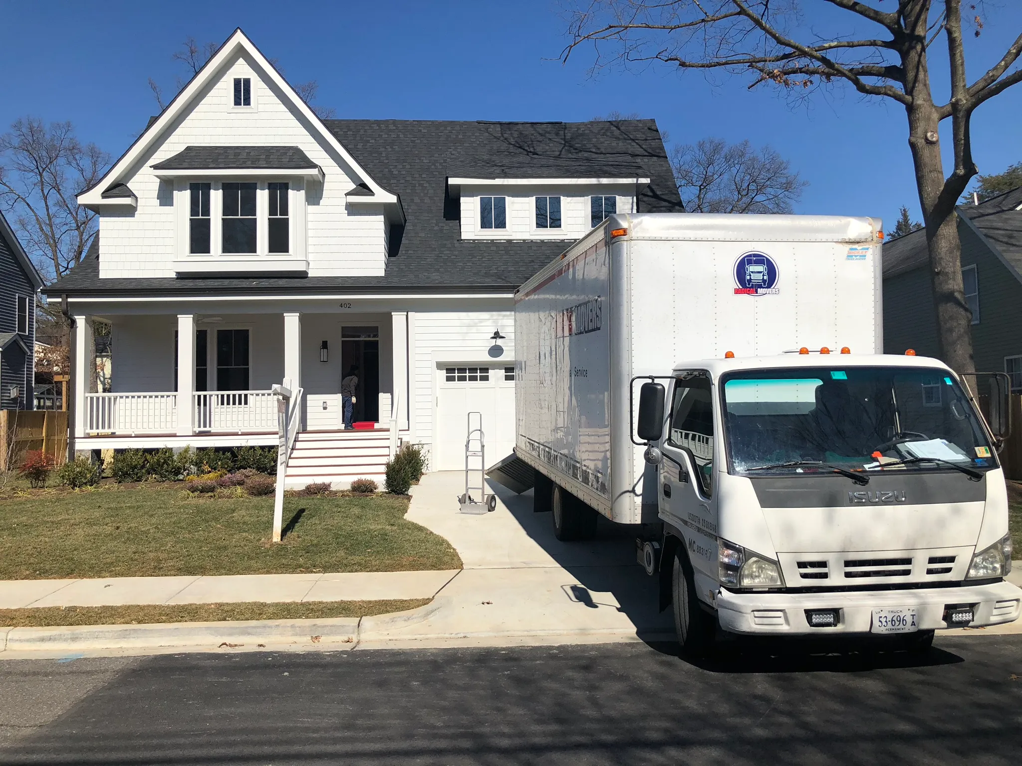 Professional movers carefully handling residential items